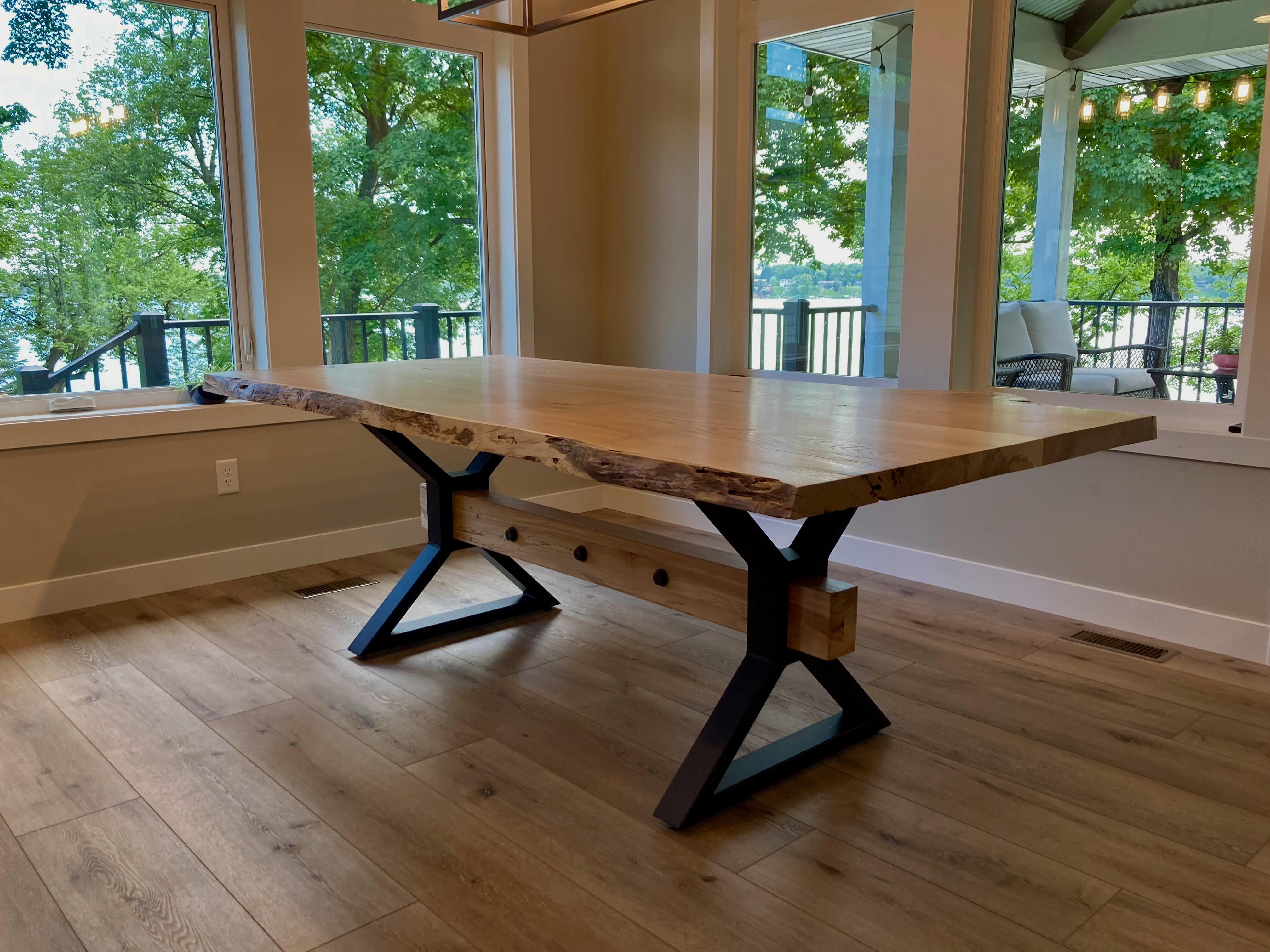 Handcrafted wooden table with metal legs